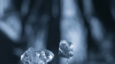 Cubes falling and bouncing on puddle, Slow Motion Stock Footage 31819601