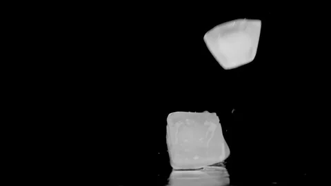 A Cubes Of Ice Falling On Wet Surface Stock Footage 146828309