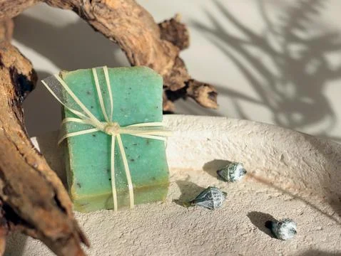 Cubes of natural soap against backdrop of natural elements. Handicrafts and Stock Photos