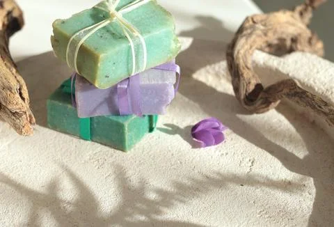 Cubes of natural soap against backdrop of natural elements. Handicrafts and Stock Photos