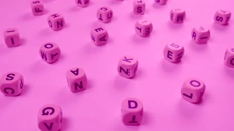 Cubes or blocks word with letters randomly on a pink background - the concept of Stock Footage 218253732