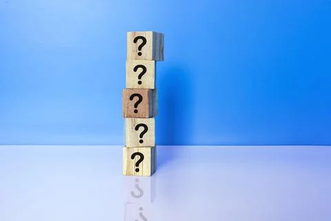 Cubes with question marks with reflection on white background. Stock Photos
