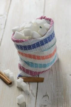 Cubes of sugar in canvas bag Stock Photos