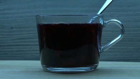 Cubes of sugar fall into red tea 스톡 동영상 79990409