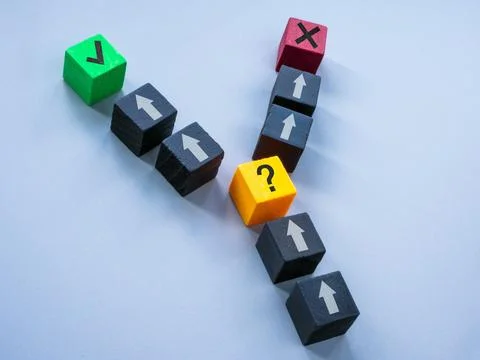Cubes as a symbol of making a right or wrong decision. Control and choice. Stock Photos