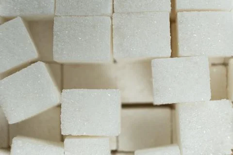 Cubes of white crystalline beetroot refined sugar. Stock Photos