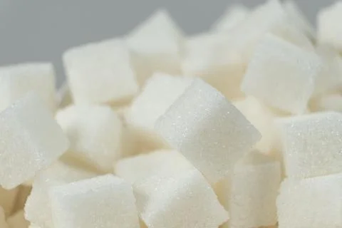 Cubes of white crystalline beetroot refined sugar. Stock Photos