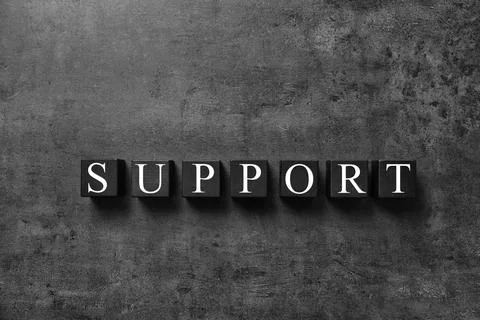 Cubes with word SUPPORT on dark grey background, top view. Technical service 写真素材