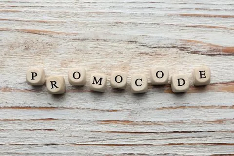 Cubes with words Promo Code on white wooden table, flat lay Stock Photos