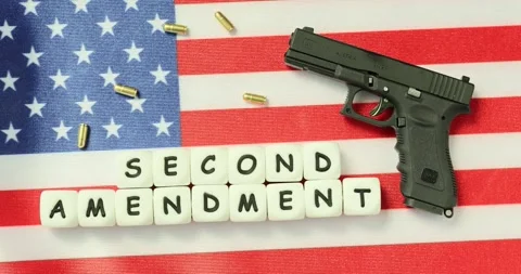 Cubes with words Second Amendment on American flag and gun near Stock Footage 279956433
