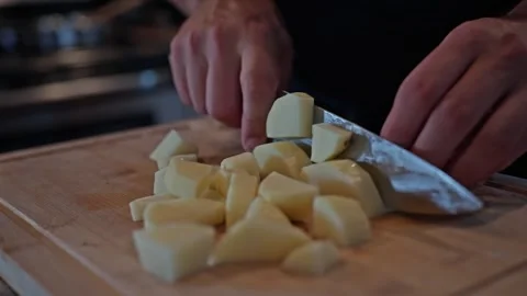 Cubing Peeled Potatoes with Precision Video stock 325222819