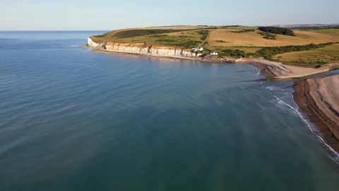 Cuckmere Haven from air looking over sea back to land, East Sussex Stock Footage 247128850