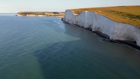 Cuckmere Haven flight over Seven Sisters from sea looking down on chalk cliff Stock Footage 247128861