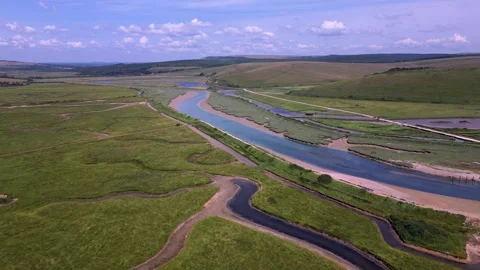 Cuckmere Haven River Cuckmere meanders heading North, East Sussex, UK Stock Footage 244640047