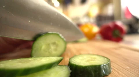 Cucmber slicing Slow Motion sequence Stock Footage 68672296
