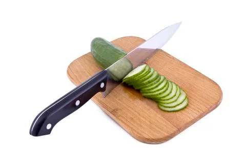 Cucumber and kitchen knife Stock Photos