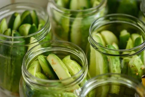 Cucumber background many cucumbers. cucumbers from the field. In glass jars Stock Photos
