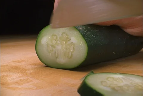 A cucumber being sliced, close-up Stock Footage 86883719
