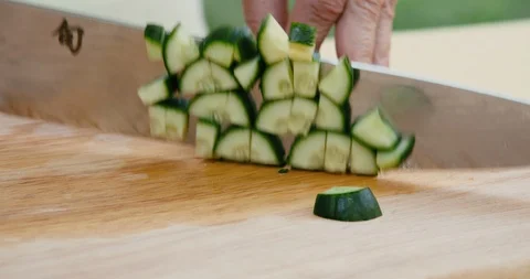 Cucumber chopping close up Stock Footage 119844808