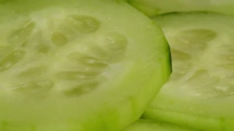 Cucumber close-up macro. Slice fresh cucumbers vegetable texture background Stock Footage 261058167