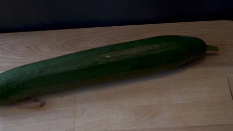 Cucumber on a cutting board. 4K. Video stock 112377102