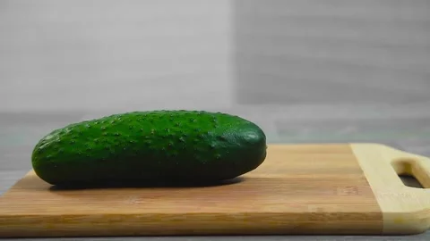 Cucumber falls on a cutting board Video stock 194163291