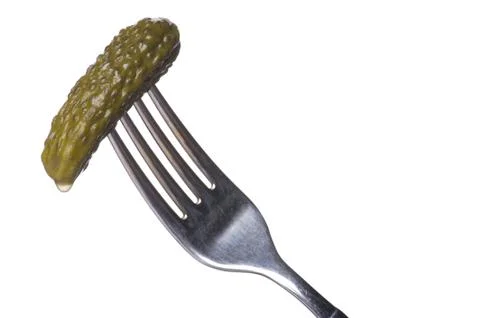 Cucumber on fork close up Stock Photos