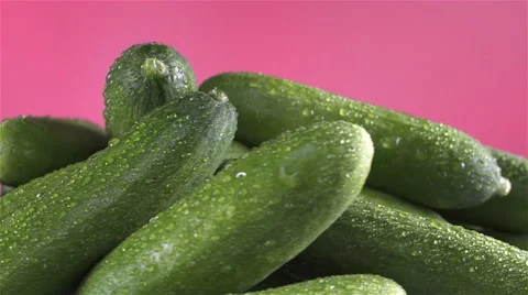 Cucumber isolated rotating on pink background Stock Footage 62405240