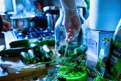 Cucumber in the jar - pickle preparation process in the kitchen Stock Photos