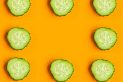 Cucumber pattern on bright orange background, minimal concept, copy space for Stockfoto's