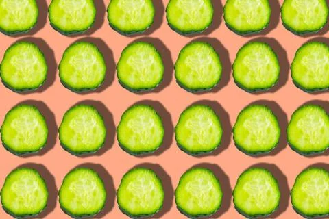 Cucumber pattern on pink background, minimal concept Stock Photos