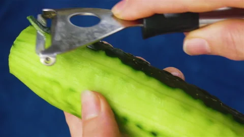 Cucumber Peeled with Vegetable Peeler Stock Footage 143251602