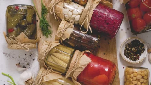 Cucumber, pepper, tomatoes, mushrooms pickling and canning into glass jars Stock-Footage 209282591