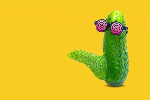 Cucumber with Phallic Shape and Hypnotic Glasses on Yellow.. Stock-Fotos