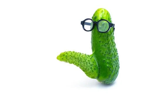Cucumber with Phallic Shape Wearing Spectacles on White.. Stock-Fotos