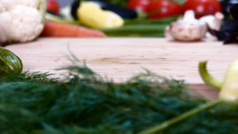 Cucumber rolls over the board Stock Footage 78055495