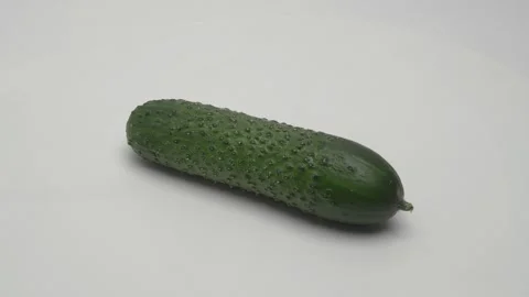 Cucumber rotates on a white background. Видео 266005959
