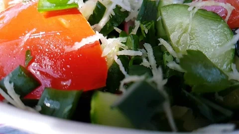 Cucumber salad celery tomatoes slow-motion shot Stock Footage 93487876