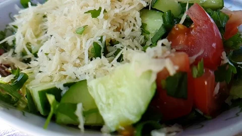 Cucumber salad celery tomatoes slow-motion shot pouring oil Stock Footage 93488359