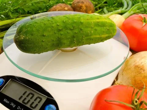 Cucumber on the Scales Stock Photos