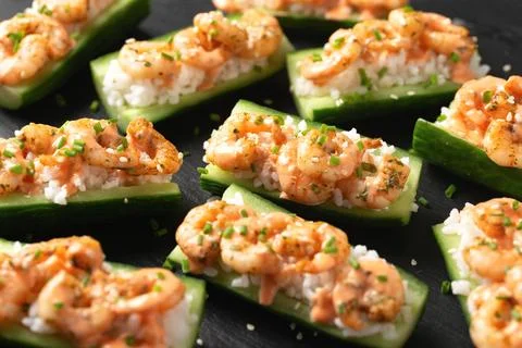 Cucumber Shrimp Sushi Boats with Spicy Mayo, Rice, Chives and sesame seeds Stock Photos