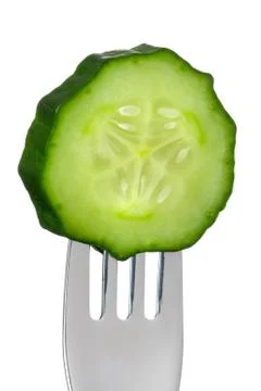 Cucumber slice on a fork isolated Stock Photos