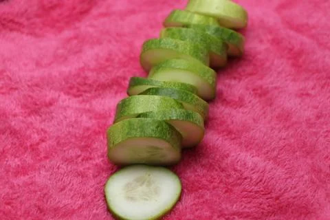 Cucumber slice with pink background Stock Photos