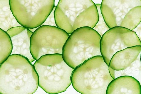 Cucumber slices arranged in an appealing pattern, showcasing vibrant green .. Foto stock