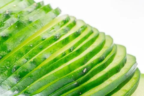 Cucumber slices arranged in a fan pattern, vibrant green color, crisp and j.. Stock Photos