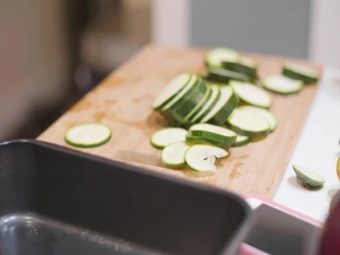 Cucumber slices on a cutting board Stock Footage 80545840