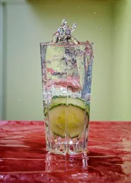 Cucumber splash glass water Stock Photos