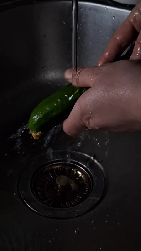 Cucumber under a tap with water Stock-Footage 342662644