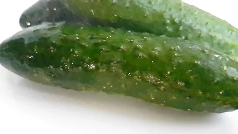 Cucumber wet on white background splashes Stock Footage 87987385