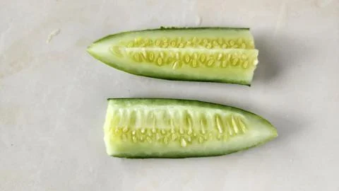 Cucumber on a white background, top view, close-up Stock Photos